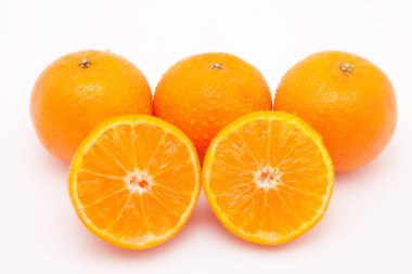 Tasty juicy mandarines on white background with waterdrops