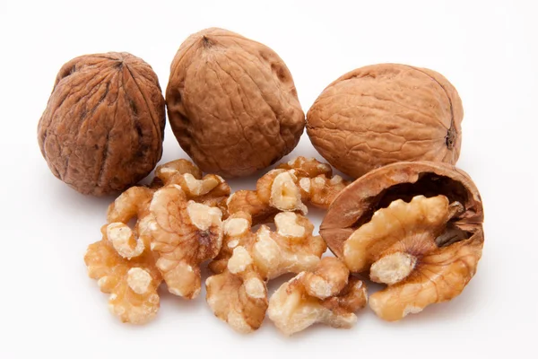 Open walnuts on white background — Stock Photo, Image