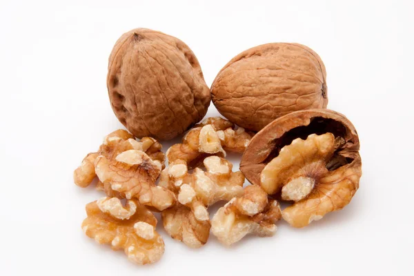 Open walnuts on white background — Stock Photo, Image