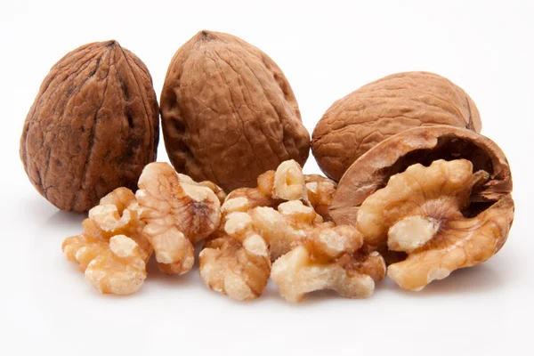 Open walnuts on white background — Stock Photo, Image