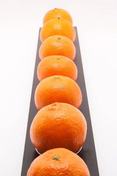 Row of mandarines on white background — Stock Photo, Image