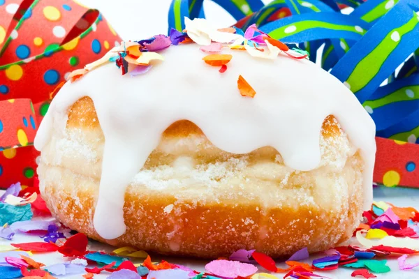 Donut for a party isolated on white background with air streamers and confe — Stock Photo, Image