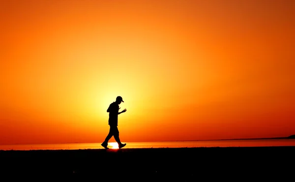 Jogger in sunset