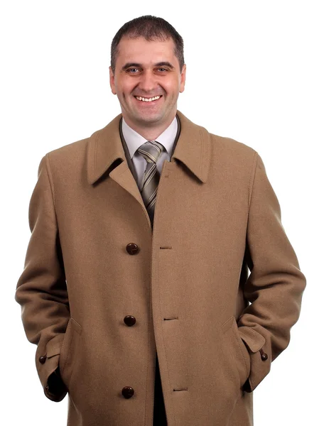 Smiling man in light brown coat isolated on white — Stock Photo, Image