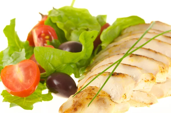 Fried chicken fillet with green chives and salad on white — Stock Photo, Image