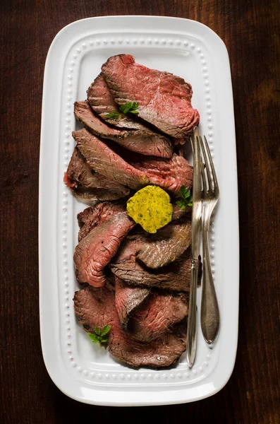 Juicy roastbeef slices on white plate — Stock Photo, Image