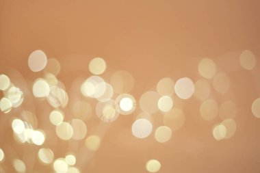 Soyut bej bokeh çözünmüş arkaplan. Parıltı.