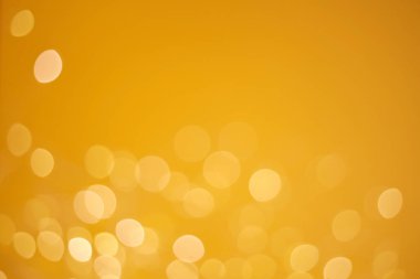 Soyut sarı bokeh çözünmüş arka plan. Parıltı.