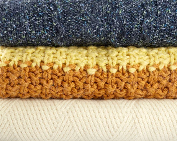 Background Warm Knitted Sweaters Stack Blue Yellow Orange White Sweaters — Stock Photo, Image