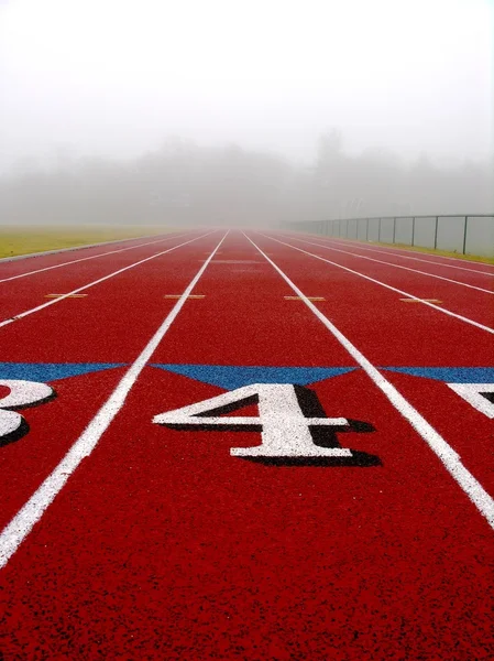 Numbered lanes on a foggy morning — Stock Photo, Image