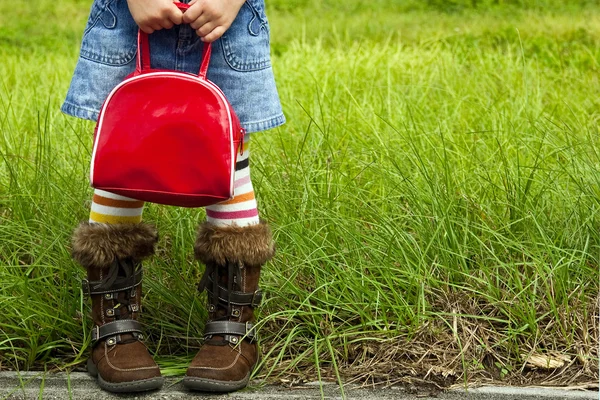 Girl holding a red purse — Stock Photo, Image