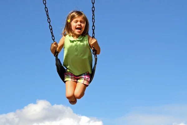 Girl swinging — Stock Photo, Image