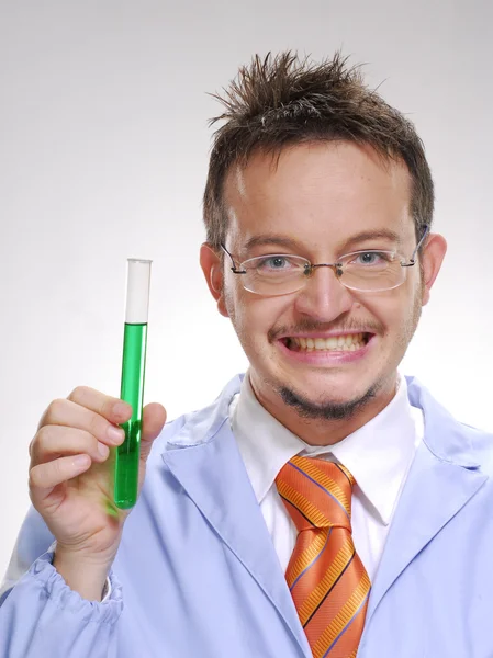 Funny young scientist holding an experimental tube. A doctor holding a glass tube. — Stock Photo, Image