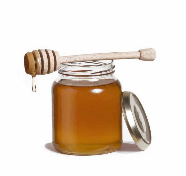 Honey pot and dipper. Honey drop and dipper. Stock Photo