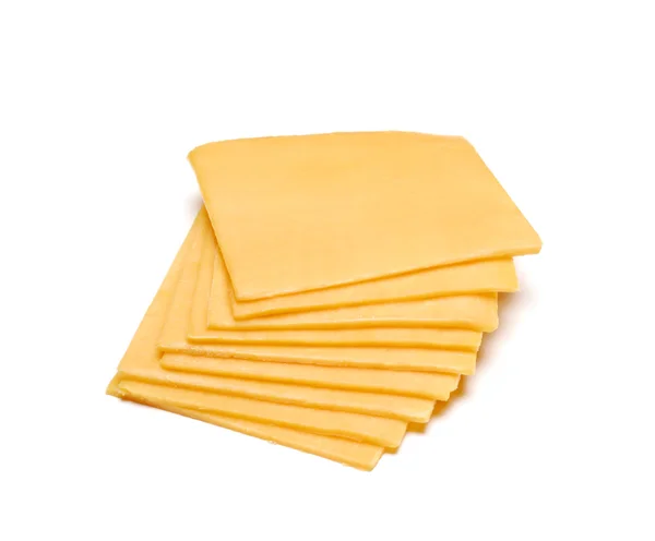 Fatias de queijo Cheddar no fundo branco . Fotos De Bancos De Imagens