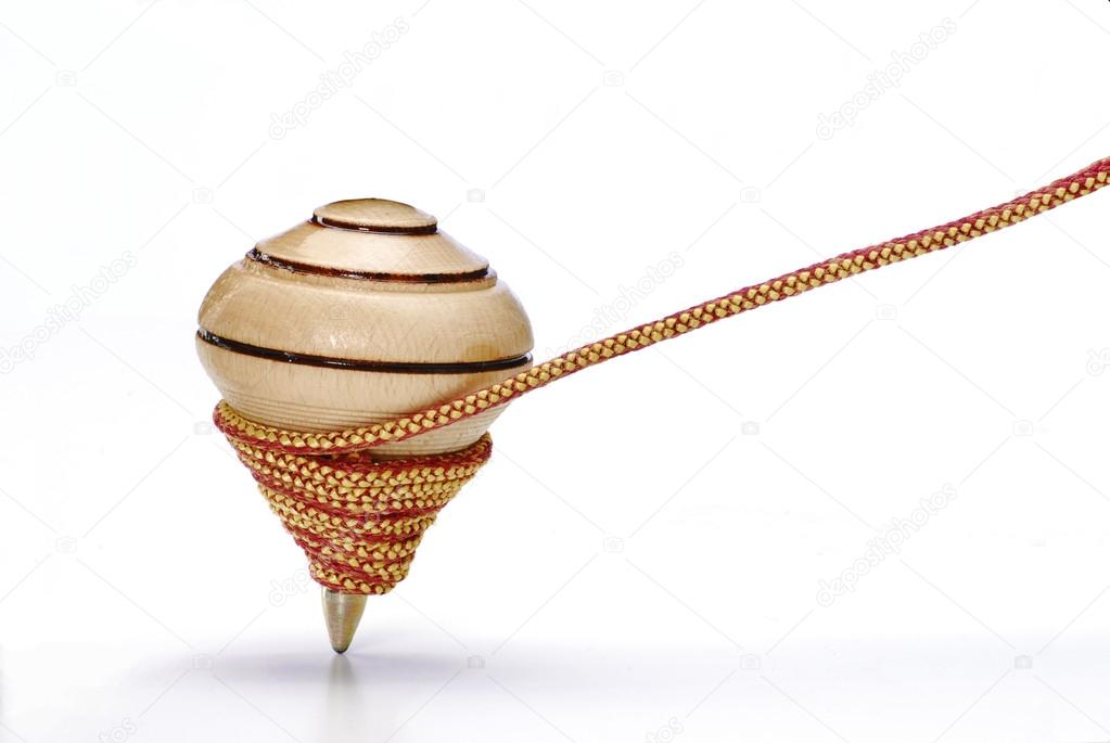 Stuepige jeg er enig kurve Wood spinning top on white background and string. Stock Photo by  ©Gustavo_Andrade 13766039