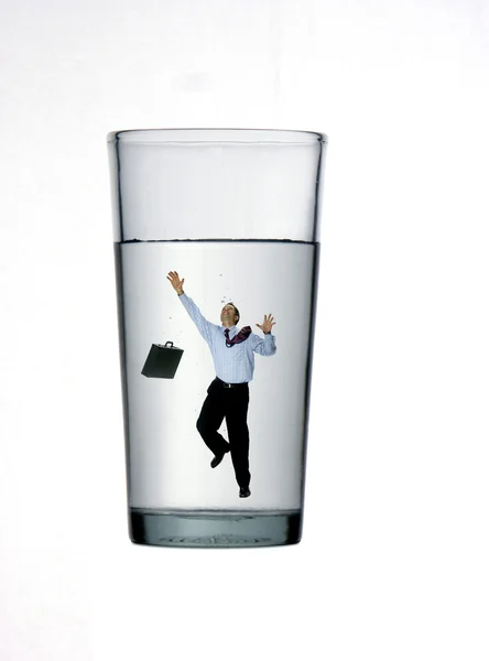 One businessman inside a glass on white background. — Stock Photo, Image