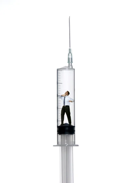 One businessman inside a syringe on white background. — Stock Photo, Image