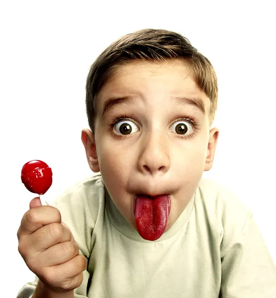 Close up van jonge jongen eten een lolly. — Stockfoto