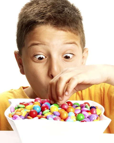 Little boy is eating candy — Stock Photo, Image