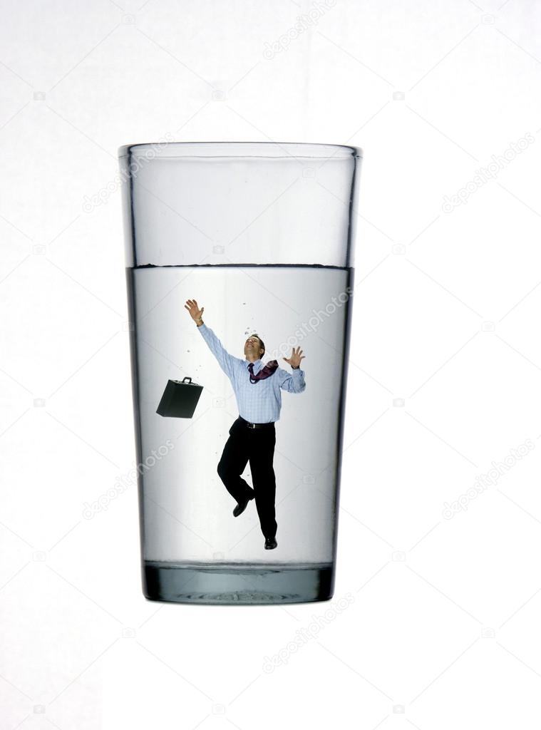 One businessman inside a glass on white background.