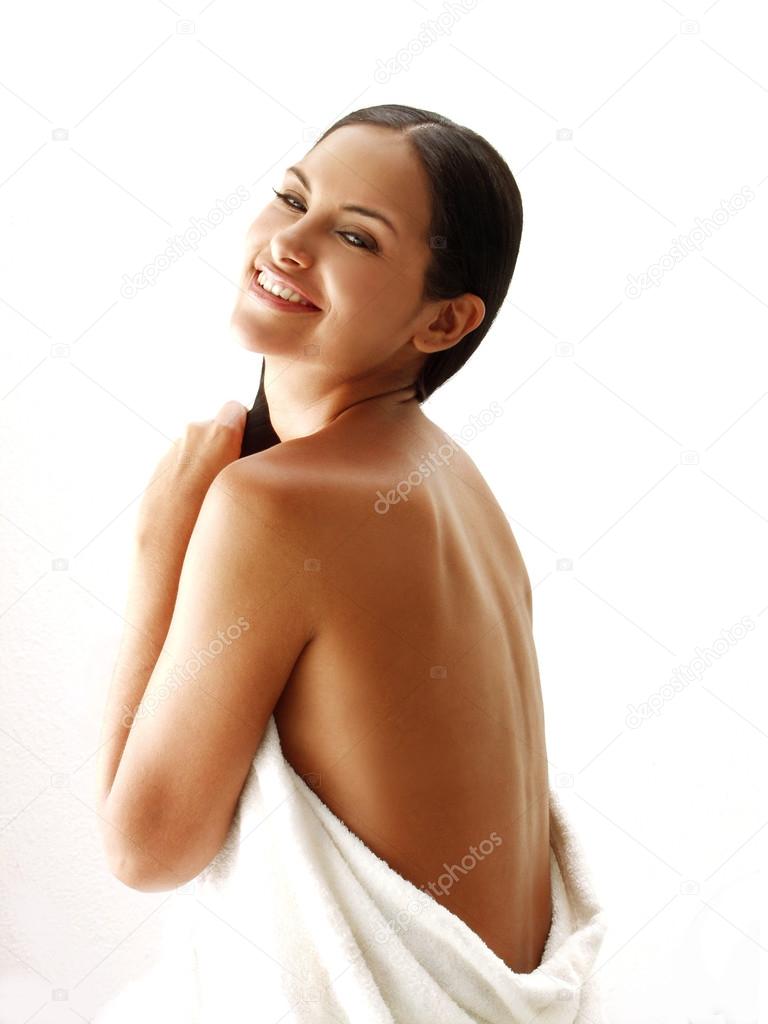 Beautiful young latin woman on white background.