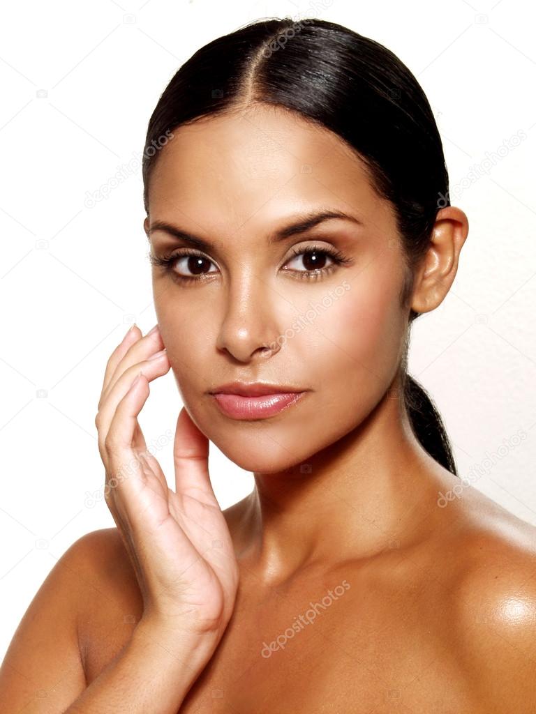Beautiful young latin woman on white background. Closeup portrait of young beautiful woman after bath - spa