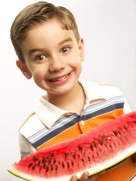 Little boy holding a big watermelon. — Stock Photo, Image