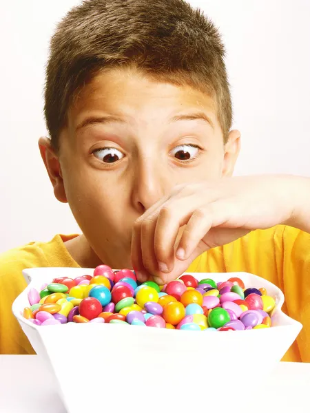 Little boy is eating candy — Stock Photo, Image