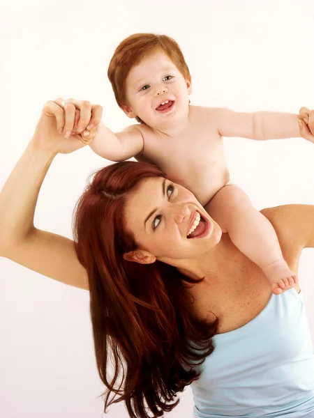 Caucasian young mother enjoying her child. — Stock Photo, Image