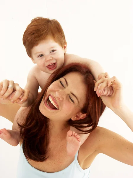 Caucasian young mother enjoying her child. — Stock Photo, Image