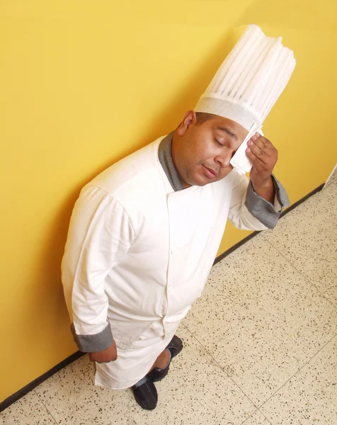 Exhausted cook in a kitchen, a cook working in a kitchen — Stock Photo, Image