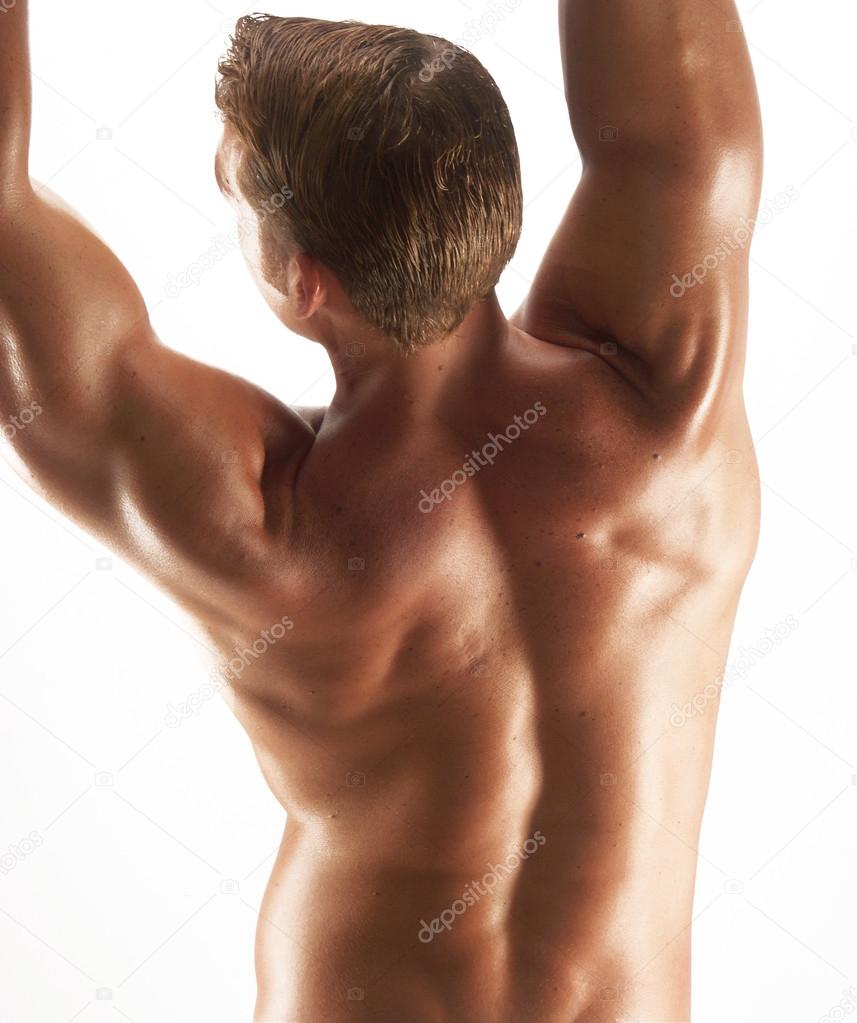 Shaped and young man stretching his muscles.