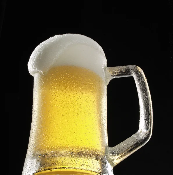 Fresh beer glass on black background. — Stock Photo, Image