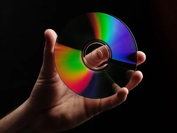 Mano che tiene un compact disc — Foto Stock