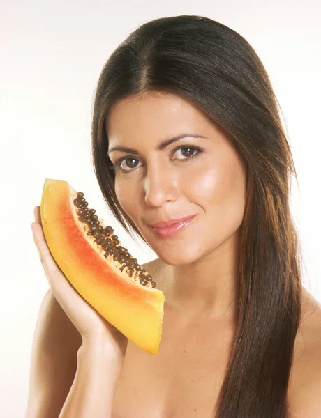 Young woman holding a slice of pumpkins — Stock Photo, Image