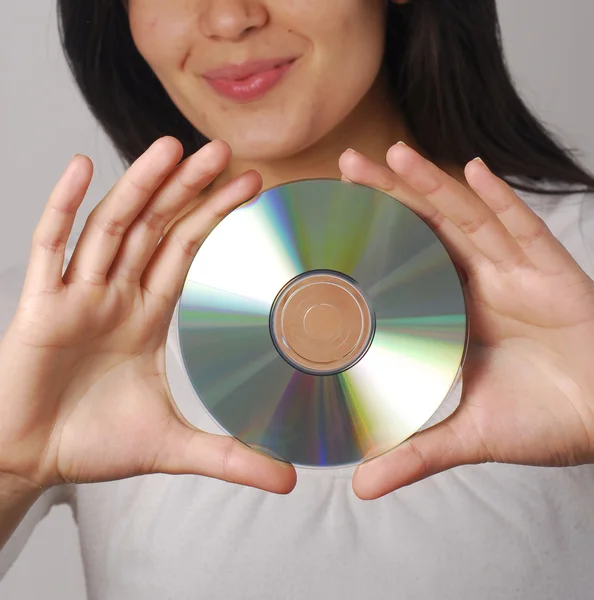 Hispanic woman portrait holding a compact disc — Stock Photo, Image