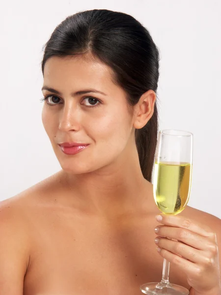 Young woman holding a champagne glass Royalty Free Stock Images