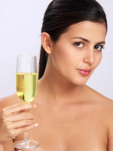 Young woman holding a champagne glass Royalty Free Stock Images