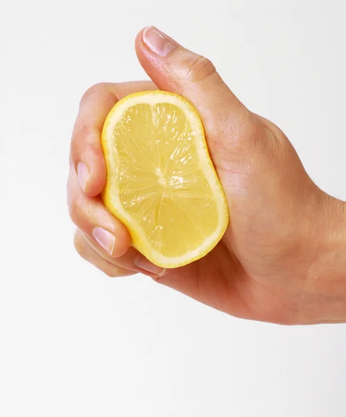 Hand squeezing a lemon,lemon drop — Stock Photo, Image