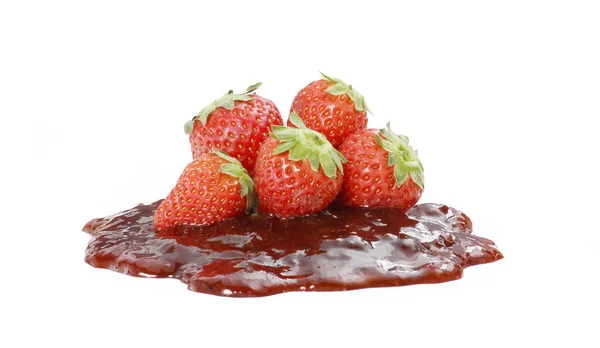 Strawberries over strawberry jam on white background — Stock Photo, Image