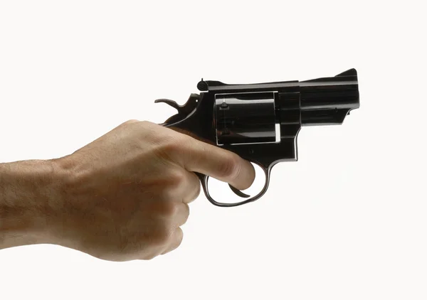 Apontando arma no fundo branco — Fotografia de Stock