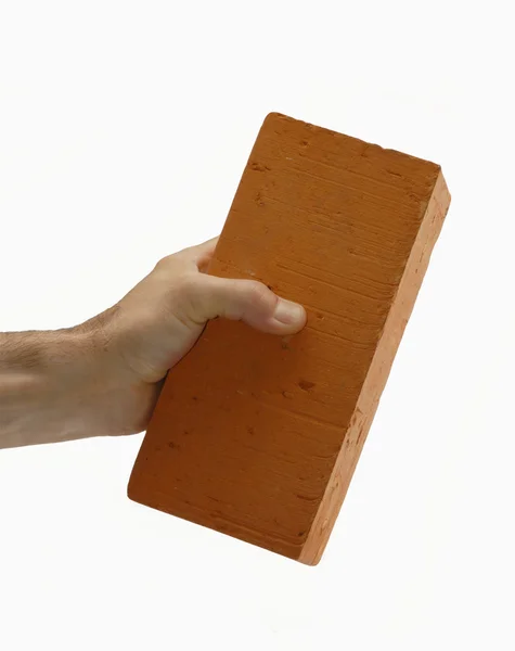 Mão segurando no tijolo — Fotografia de Stock