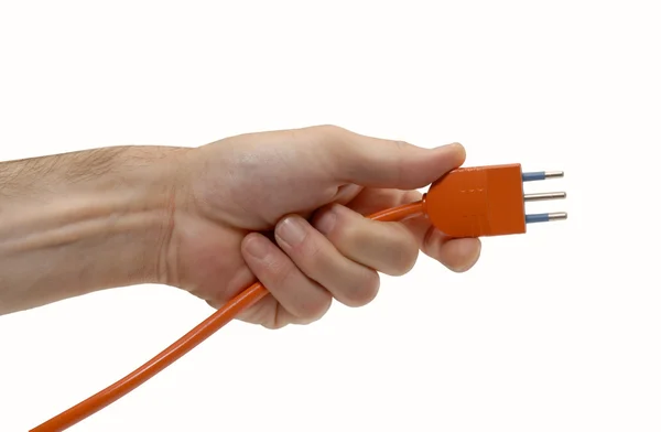 Hand inserting red electrical plug — Stock Photo, Image