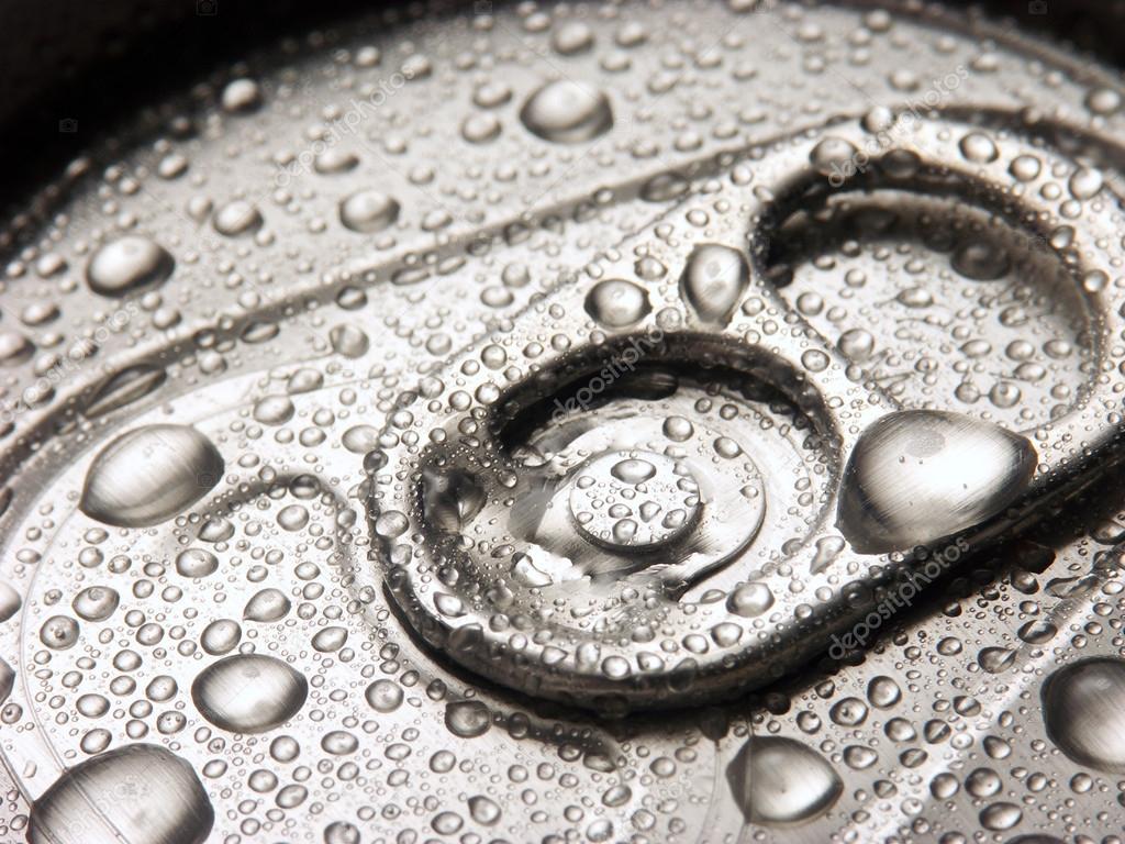 Closeup of soda or pop can with drops of water for freshness