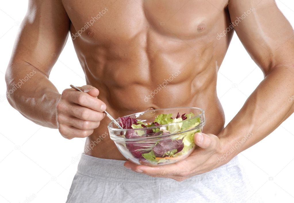 Shaped and healthy body man holding a fresh salad bowl,shaped abdominal