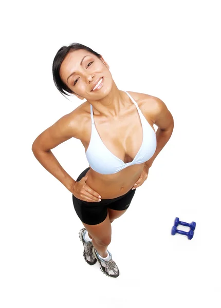 Mujer joven haciendo ejercicio de fitness detrás de un peso de la mano . — Foto de Stock