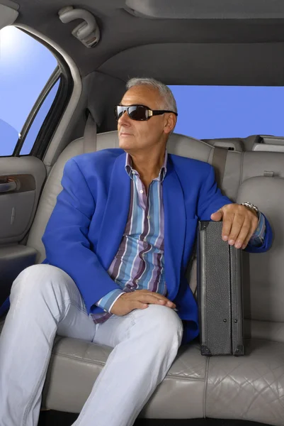 Successful senior businessman inside a car — Stock Photo, Image