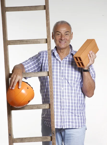 Senior architect behind a wood scale. — Stock Photo, Image