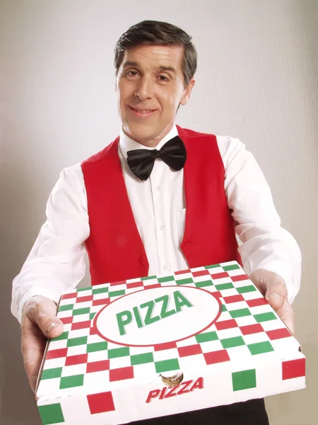 Pizza delivery man holding pizza box — Stock Photo, Image